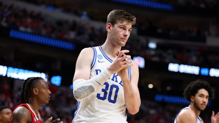 Mar 31, 2024; Dallas, TX, USA; Duke Blue Devils center Kyle Filipowski (30) reacts in the first half against the North Carolina State Wolfpack in the finals of the South Regional of the 2024 NCAA Tournament at American Airline Center. Mandatory Credit: Tim Heitman-USA TODAY Sports
