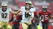 Dec 7, 2025; Tampa, Florida, USA; New Orleans Saints quarterback Tyler Shough (6) runs for a gain during the third quarter against the Tampa Bay Buccaneers at Raymond James Stadium. Mandatory Credit: Nathan Ray Seebeck-Imagn Images