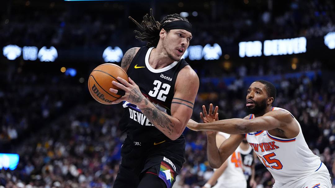 Mar 6, 2026; Denver, Colorado, USA; Denver Nuggets forward Aaron Gordon (32) and New York Knicks guard Mikal Bridges (25) during the second quarter at Ball Arena. Mandatory Credit: Ron Chenoy-Imagn Images