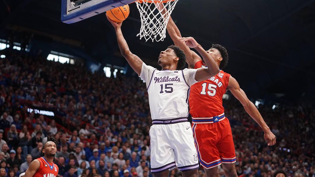 Kansas State Wildcats forward Taj Manning (15) shoots the ball against Kansas Jayhawks during the Sunflower Showdown game inside Allen Fieldhouse in Lawrence, Kansas, on Saturday, March 7, 2026.