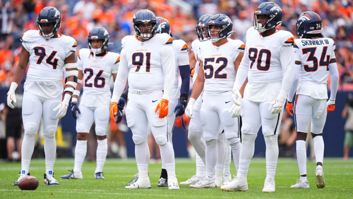 Aug 25, 2024; Denver, Colorado, USA; Members of the Denver Broncos defensive team during the first quarter against the Arizona Cardinals at Empower Field at Mile High.