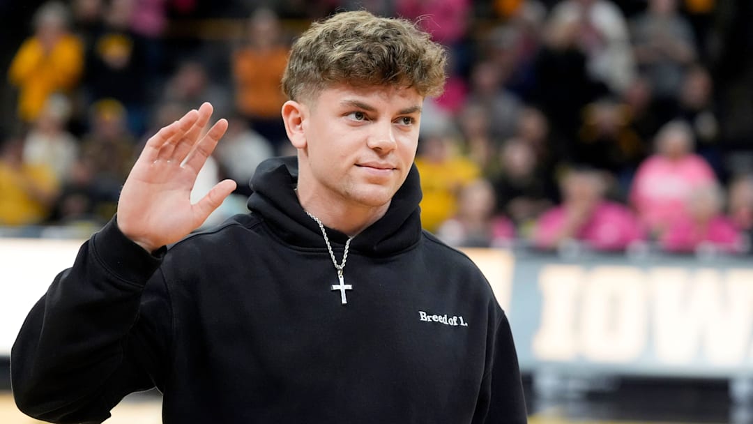 Former Iowa football player and Super Bowl LIX champion Cooper DeJean is interviewed on court during halftime of the Iowa women’s basketball game against UCLA Sunday, Feb. 23, 2025 at Carver-Hawkeye Arena in Iowa City, Iowa.
