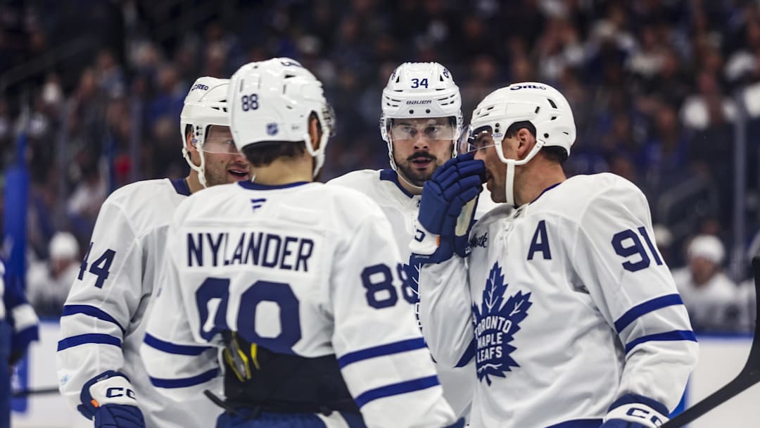 Feb 25, 2026; Tampa, Florida, USA; Toronto Maple Leafs forward Auston Matthews (34), defenseman Morgan Rielly (44), forward William Nylander (88), and forward John Tavares (91) huddle before a face-off against the Tampa Bay Lightning during the second period at Benchmark International Arena. Mandatory Credit: Morgan Tencza-Imagn Images
