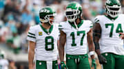 Dec 15, 2024; Jacksonville, Florida, USA; New York Jets quarterback Aaron Rodgers (8) and wide receiver Davante Adams (17) was out to the field after a turnover against the Jacksonville Jaguars in the first quarter at EverBank Stadium. Mandatory Credit: Nathan Ray Seebeck-Imagn Images