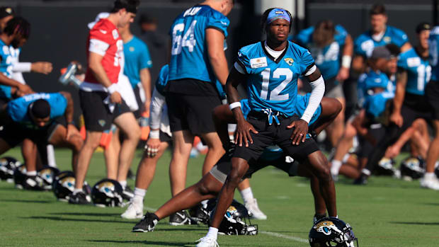 Jacksonville Jaguars wide receiver Travis Hunter (12) warms up during the second mandatory minicamp at Miller Electric Center