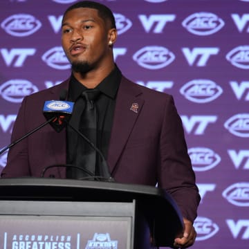 Jul 23, 2024; Charlotte, NC, USA; Virginia Tech quarterback Kyron Drones answers questions from the media during the ACC Kickoff at Hilton Charlotte Uptown. Mandatory Credit: Jim Dedmon-USA TODAY Sports