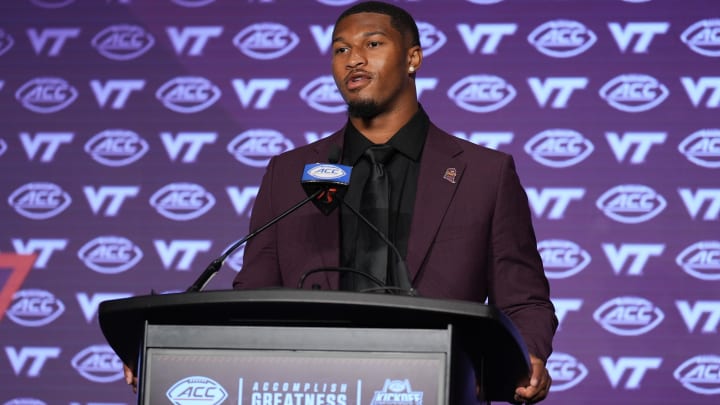 Jul 23, 2024; Charlotte, NC, USA; Virginia Tech quarterback Kyron Drones answers questions from the media during the ACC Kickoff at Hilton Charlotte Uptown. Mandatory Credit: Jim Dedmon-USA TODAY Sports