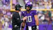 Oct 18, 2025; Fort Worth, Texas, USA; TCU Horned Frogs quarterback Josh Hoover (10) talks with associate head coach Kendal Briles during the first half of a game against the Baylor Bears at Amon G. Carter Stadium. Mandatory Credit: Raymond Carlin III-Imagn Images