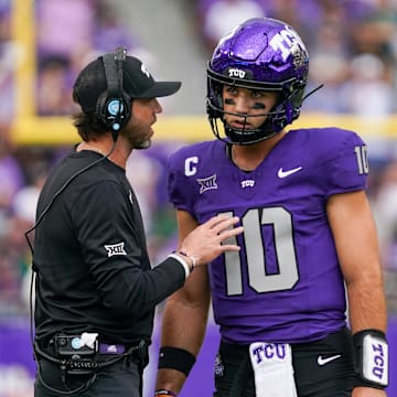 Oct 18, 2025; Fort Worth, Texas, USA; TCU Horned Frogs quarterback Josh Hoover (10) talks with associate head coach Kendal Briles during the first half of a game against the Baylor Bears at Amon G. Carter Stadium. Mandatory Credit: Raymond Carlin III-Imagn Images