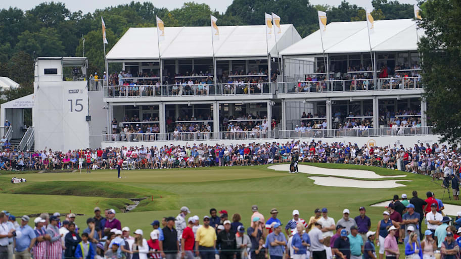 Justin Thomas putts on the 15th green during the singles match play of the Presidents Cup golf tournament at Quail Hollow Clu