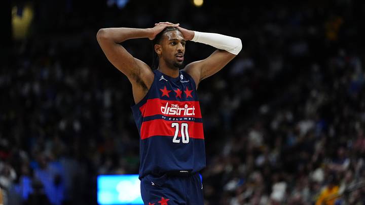 Mar 15, 2025; Denver, Colorado, USA; Washington Wizards forward Alex Sarr (20) reacts in the second half against the Washington Wizards at Ball Arena. Mandatory Credit: Ron Chenoy-Imagn Images