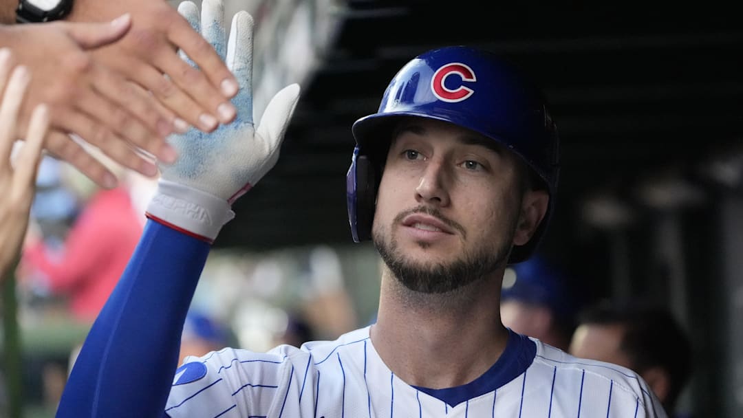 Oct 2, 2025; Chicago, Illinois, USA; Chicago Cubs outfielder Kyle Tucker (30) is greeted in the dugout after scoring against the San Diego Padres during game three of the Wildcard round for the 2025 MLB playoffs at Wrigley Field. Mandatory Credit: David Banks-Imagn Images