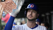 Oct 2, 2025; Chicago, Illinois, USA; Chicago Cubs outfielder Kyle Tucker (30) is greeted in the dugout after scoring against the San Diego Padres during game three of the Wildcard round for the 2025 MLB playoffs at Wrigley Field. Mandatory Credit: David Banks-Imagn Images