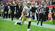 Dec 7, 2025; Tampa, Florida, USA; New Orleans Saints quarterback Tyler Shough (6) runs for a touchdown during the fourth quarter against the Tampa Bay Buccaneers at Raymond James Stadium. Mandatory Credit: Kim Klement Neitzel-Imagn Images
