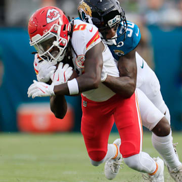 Jacksonville Jaguars cornerback Montaric Brown (30) tackles Kansas City Chiefs wide receiver Hollywood Brown (5) during the first quarter of a preseason NFL football game Saturday, Aug. 10, 2024 at EverBank Stadium in Jacksonville, Fla. [Corey Perrine/Florida Times-Union]