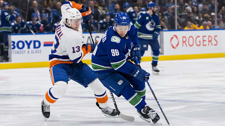 Nov 15, 2023; Vancouver, British Columbia, CAN; New York Islanders forward Mathew Barzal (13) skates after Vancouver Canucks forward Andrei Kuzmenko (96) in the third period at Rogers Arena. Vancouver won 4-3 in overtime. Mandatory Credit: Bob Frid-Imagn Images Nov 15, 2023; Vancouver, British Columbia, CAN; New York Islanders forward Mathew Barzal (13) skates after Vancouver Canucks forward Andrei Kuzmenko (96) in the third period at Rogers Arena. Vancouver won 4-3 in overtime. Mandatory Credit: Bob Frid-Imagn Images
