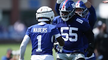 New York Giants wide receiver Malik Nabers celebrates with offensive tackle James Hudson III during training camp