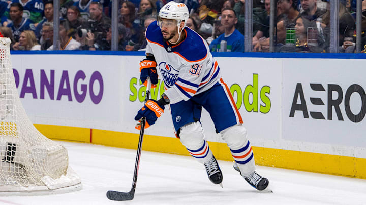 May 16, 2024; Vancouver, British Columbia, CAN; Edmonton Oilers forward Evander Kane (91) handles the puck against the Vancouver Canucks during the third period in game five of the second round of the 2024 Stanley Cup Playoffs at Rogers Arena. Mandatory Credit: Bob Frid-Imagn Images