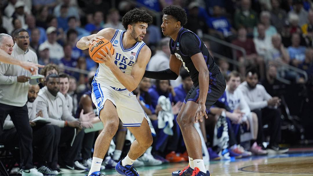 Mar 21, 2026; Greenville, SC, USA; Duke Blue Devils forward Cameron Boozer (12) handles the ball defended by Texas Christian University Horned Frogs forward Xavier Edmonds (24) during a second round game of the men's 2026 NCAA Tournament at Bon Secours Wellness Arena. Mandatory Credit: Jim Dedmon-Imagn Images Mar 21, 2026; Greenville, SC, USA; Duke Blue Devils forward Cameron Boozer (12) handles the ball defended by Texas Christian University Horned Frogs forward Xavier Edmonds (24) during a second round game of the men's 2026 NCAA Tournament at Bon Secours Wellness Arena. Mandatory Credit: Jim Dedmon-Imagn Images