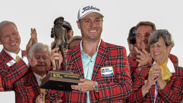 Apr 20, 2025; Hilton Head, South Carolina, USA; Justin Thomas holds his trophy and wears the plaid jacket after winning the final round of the RBC Heritage golf tournament. Mandatory Credit: Jim Dedmon-Imagn Images