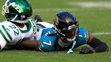 Jacksonville Jaguars wide receiver Brian Thomas Jr. (7) comes up with a face full of turf against New York Jets safety Tony Adams (22) during the third quarter Sunday, Dec. 15, 2024 at EverBank Stadium in Jacksonville, Fla. The Jets held off the Jaguars 32-25.
