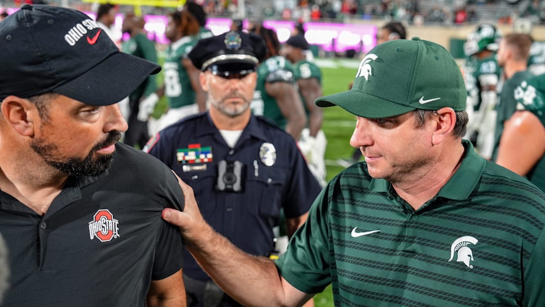 Michigan State Spartans head coach Jonathan Smith shakes hands with Ohio State Buckeyes head coach Ryan Day after the NCAA football game against Ohio State University at Spartan Stadium in East Lansing, Saturday, Sept. 28, 2024.