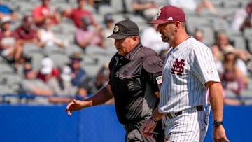 May 21, 2025; Hoover, AL, USA; Mississippi State interim head coach Justin Parker discusses things with home plate umpire David Savage during the game with Texas A&M in the first round of the SEC Baseball Tournament at the Hoover Met.