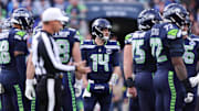 Nov 9, 2025; Seattle, Washington, USA; Seattle Seahawks quarterback Sam Darnold (14) looks on during the second quarter against the Arizona Cardinals at Lumen Field. Mandatory Credit: Kevin Ng-Imagn Images