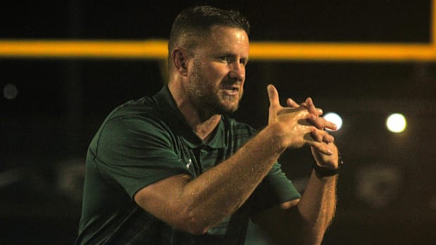 Nease head coach Collin Drafts addresses his team after defeating Buchholz 20-17 in overtime in high school football on Septe