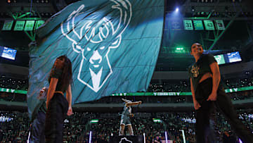 Feb 8, 2024; Milwaukee, Wisconsin, USA;  Milwaukee Bucks mascot Bango waves a flag with the Milwaukee Bucks logo prior to the game against the Minnesota Timberwolves at Fiserv Forum. Mandatory Credit: Jeff Hanisch-Imagn Images