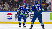 Nov 16, 2024; Vancouver, British Columbia, CAN; Vancouver Canucks defenseman Erik Brannstrom (26) and forward Jake DeBrusk (74) celebrate Brannstrom’s goal against the Chicago Blackhawks during the third period at Rogers Arena. Mandatory Credit: Bob Frid-Imagn Images