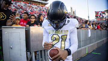 Colorado Buffaloes safety Shilo Sanders signs autographs during the fourth quarter against the Arizona Wildcats at Arizona Stadium. 