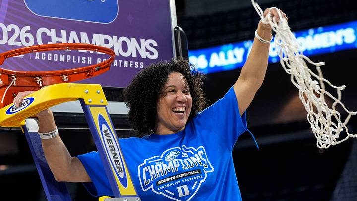 Mar 8, 2026; Duluth, GA, USA; Duke Blue Devils head coach and former Boston Celtics assistant coach Kara Lawson cuts down the net after Duke defeated the Louisville Cardinals at Gas South Arena. Mandatory Credit: Dale Zanine-Imagn Images