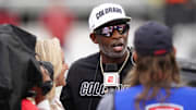 Oct 11, 2025; Boulder, Colorado, USA; Colorado Buffaloes head coach Deion Sanders is interviewed by ESPN during a time out in the first quarter against the Iowa State Cyclones at Folsom Field. Mandatory Credit: Ron Chenoy-Imagn Images