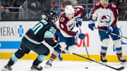 Oct 22, 2024; Seattle, Washington, USA;  Colorado Avalanche defenseman Cale Makar (8) skates against Seattle Kraken forward Eeli Tolvanen (20) during the first period at Climate Pledge Arena. Mandatory Credit: Stephen Brashear-Imagn Images