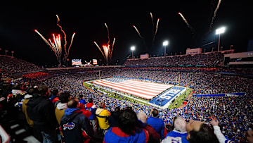 Nov 13, 2023; Orchard Park, New York, USA; The Buffalo Bills display a field wide flag to show appreciation for Veterans Day during the National Anthem prior to the game against the Denver Broncos at Highmark Stadium. Mandatory Credit: Gregory Fisher-Imagn Images