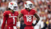 Sep 29, 2024; Glendale, Arizona, USA; Arizona Cardinals wide receiver Marvin Harrison Jr. (18) alongside quarterback Kyler Murray (1) against the Washington Commanders in the first half at State Farm Stadium. Mandatory Credit: Mark J. Rebilas-Imagn Images