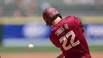 May 25, 2024; Charlotte, NC, USA; Florida State outfielder James Tibbs III (22) hits a ball in the second inning against Wake Forest during the ACC Baseball Tournament at Truist Field. Mandatory Credit: Cory Knowlton-USA TODAY Sports