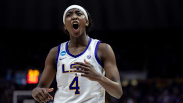 Mar 24, 2024; Baton Rouge, Louisiana, USA;  LSU Lady Tigers guard Flau'jae Johnson (4) reacts to stealing the ball from the Middle Tennessee Blue Raiders during the second half at Pete Maravich Assembly Center. Mandatory Credit: Stephen Lew-Imagn Images