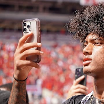 Aug 31, 2024; Columbus, OH, USA; Mater Dei wide receiver Chris Henry Jr. films as Ohio State football warms up before the Buckeyes' 52-6 win over Akron.