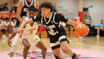 Taylen Kinney (0) dribbles by a defender during an AAU basketball game July 4, 2023, at the Nike EYBL Peach Jam in North Augusta, S.C. A Newport native, Kinney is a Class of 2026 recruit and holds a scholarship offer to play at Louisville.