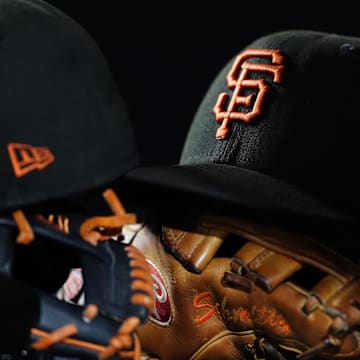 General view of San Francisco Giants caps and gloves during the sixth inning against the Colorado Rockies at Coors Field. 