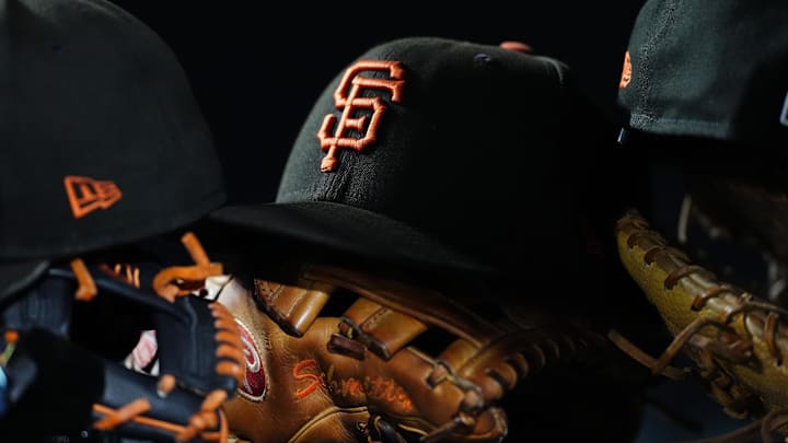 General view of San Francisco Giants caps and gloves during the sixth inning against the Colorado Rockies at Coors Field. 