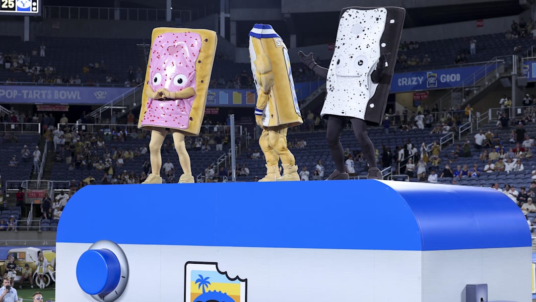 Pop-Tarts mascots stand on top of a giant toaster following BYU’s win over Georgia Tech in the Pop-Tarts Bowl at Camping World Stadium. 