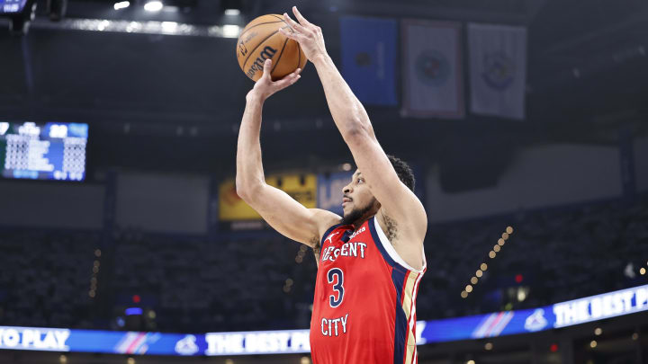 Apr 24, 2024; Oklahoma City, Oklahoma, USA; New Orleans Pelicans guard CJ McCollum (3) shoots a three-point basket against the Oklahoma City Thunder during the second quarter of game two of the first round for the 2024 NBA playoffs at Paycom Center