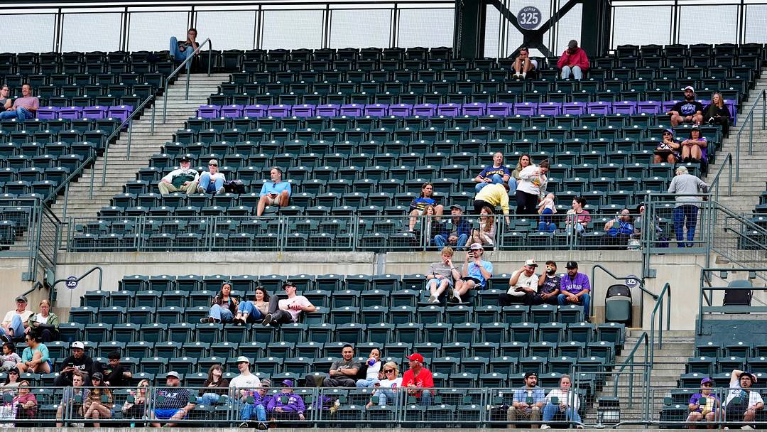 View of the sparse crowd at Coors Field earlier this season. Credit: Ron Chenoy-Imagn Images