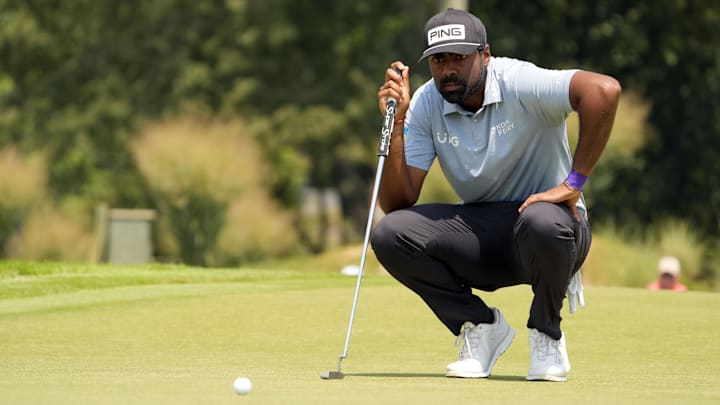 Sahith Theegala lines up a putt during the final round of the Tour Championship