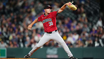 Sep 17, 2024; Denver, Colorado, USA; Arizona Diamondbacks relief pitcher Scott McGough (30) delivers a pitch in the fifth inning against the Colorado Rockies at Coors Field. Mandatory Credit: Ron Chenoy-Imagn Images