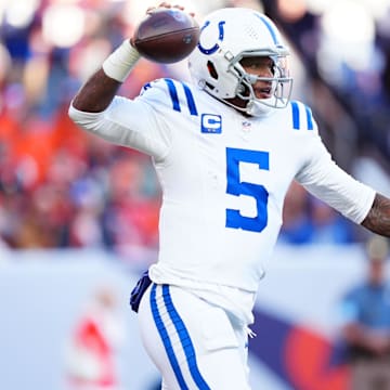 Dec 15, 2024; Denver, Colorado, USA; Indianapolis Colts quarterback Anthony Richardson (5) prepares to pass in the first half against the Denver Broncos at Empower Field at Mile High. Mandatory Credit: Ron Chenoy-Imagn Images