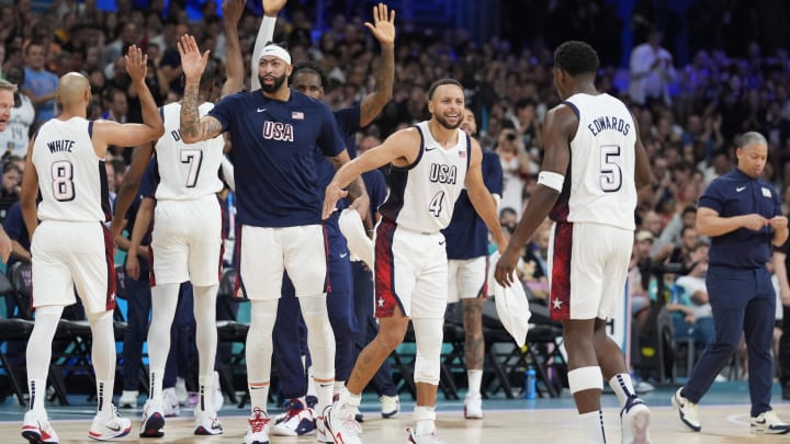 Jul 31, 2024; Villeneuve-d'Ascq, France; United States guard Stephen Curry (4) celebrates with guard Anthony Edwards (5) after a time out in the first quarter against South Sudan during the Paris 2024 Olympic Summer Games at Stade Pierre-Mauroy. 